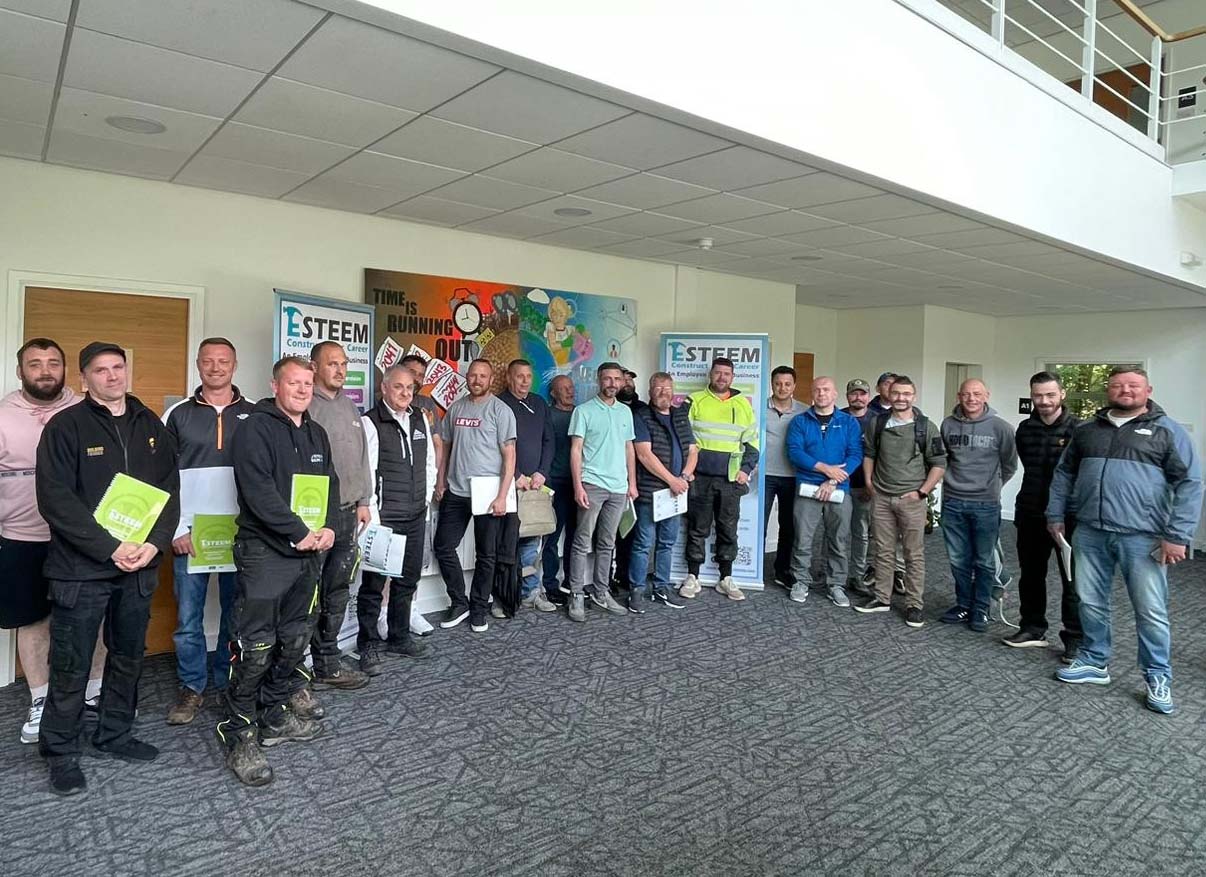 a team photo of people who have done training with funding for construction management training